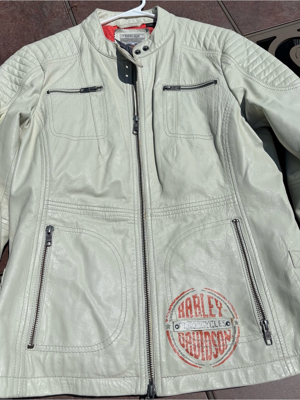 Harley-Davidson white Leather Zip Jacket with orange logo and orange liner.